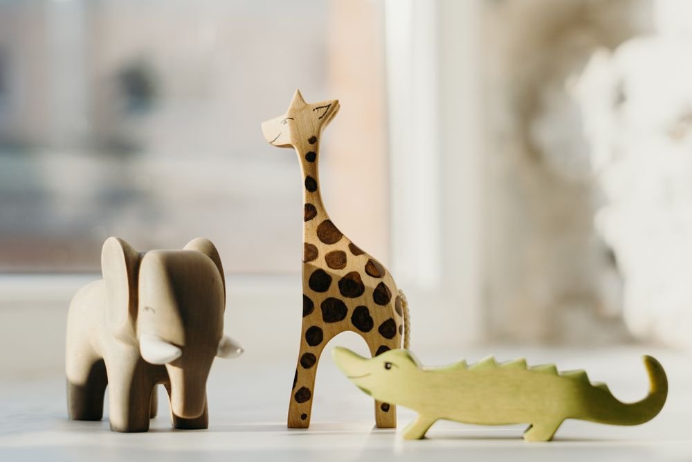 Wooden giraffe, elephant, and crocodile toy figures